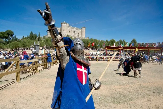 A Knight of Denmark celebrates the win during the International Medieval Combat at the castle of Belmonte, May 4, 2014, in Belmonte, Spain. (Photo by Juan Naharro Gimenez/Getty Images)