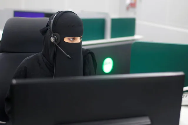 A Saudi woman works inside the first all-female call centre in the kingdom's security sector, in the holy city of Mecca, Saudi Arabia August 29, 2017. (Photo by Suhaib Salem/Reuters)