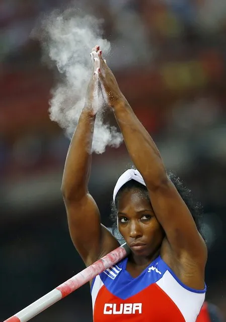 Yarisley Silva of Cuba claps her hands before an attempt as she competes in the women's pole vault final during the 15th IAAF World Championships at the National Stadium in Beijing, China, August 26, 2015. (Photo by Kai Pfaffenbach/Reuters)