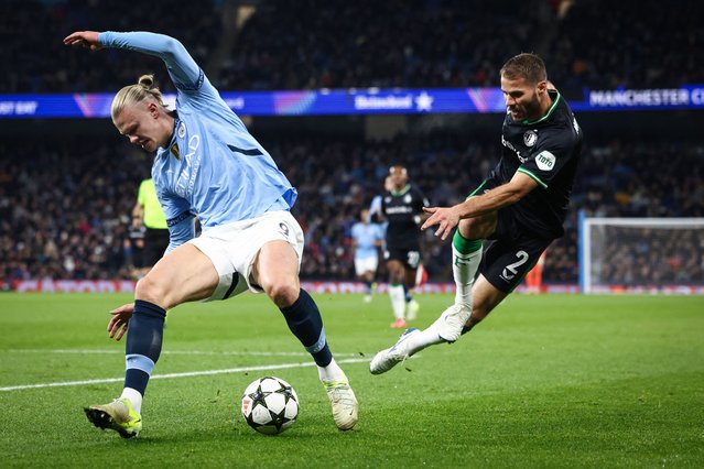 Manchester City's Norwegian striker #09 Erling Haaland (L) fights for the ball with Feyenoord's Dutch defender #02 Bart Nieuwkoop during the UEFA Champions League football match between Manchester City and Feyenoord at the Etihad Stadium in Manchester, north west England, on November 26, 2024. (Photo by Darren Staples/AFP Photo)
