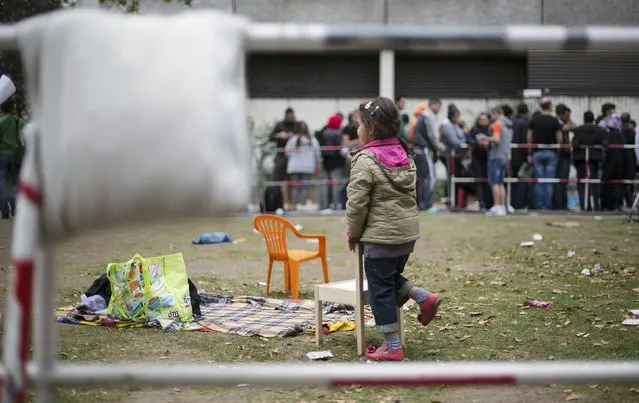 Migrants wait in front of the State Office for Health and Social Affairs (LaGeSo), in Berlin, Germany, September 3, 2015. (Photo by Hannibal Hanschke/Reuters)