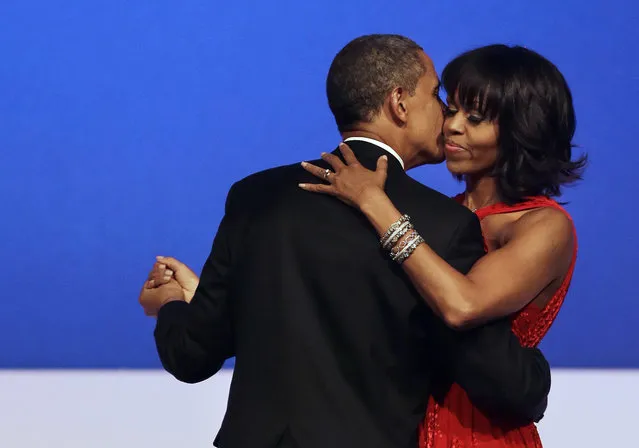 President Barack Obama kisses first lady Michelle Obama during their dance at the Commander-in-Chief Inaugural Ball at the Washington Convention Center during the 57th Presidential Inauguration on Monday, January 21, 2013, in Washington. (Photo by Jacquelyn Martin/AP Photo)