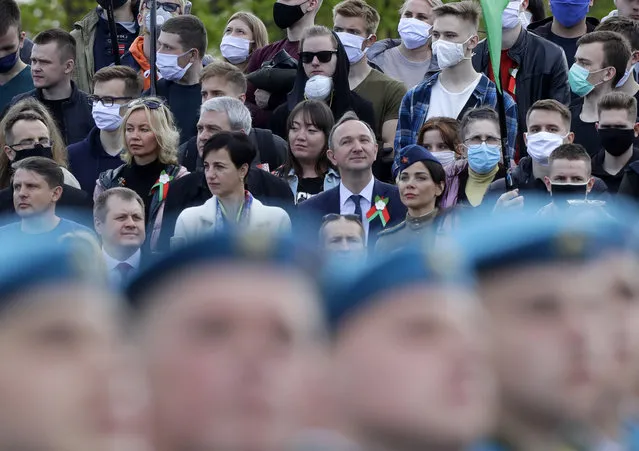 People attend the Victory Day military parade that marked the 75th anniversary of the allied victory over Nazi Germany, in Minsk, Belarus, Saturday, May 9, 2020. (Photo by Sergei Grits/AP Photo)