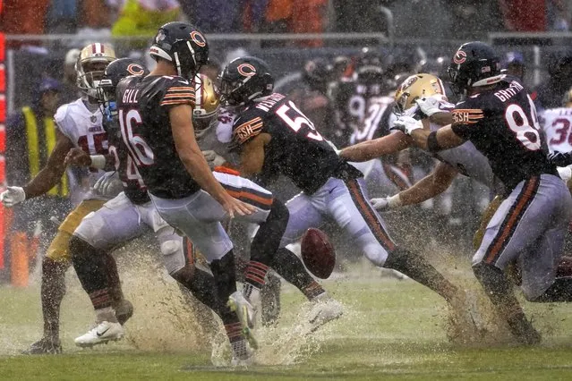 Chicago Bears' Trenton Gill punts in the rain during the second half of an NFL football game against the San Francisco 49ers Sunday, September 11, 2022, in Chicago. (Photo by Charles Rex Arbogast/AP Photo)