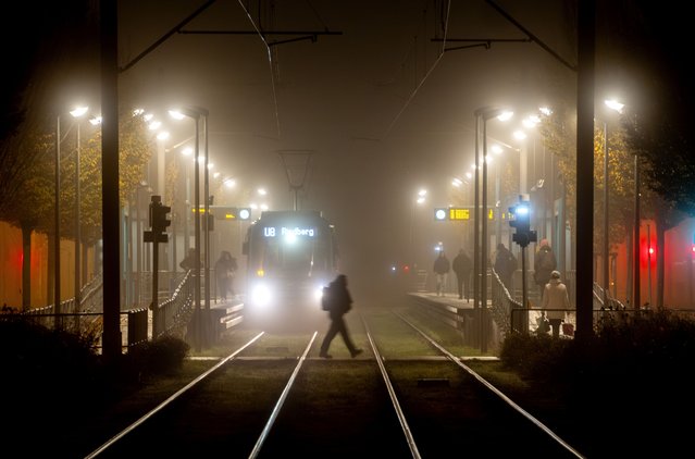 A train approaches a subway station in Frankfurt, Germany, on a foggy Monday, November 11, 2024. (Photo by Michael Probst/AP Photo)