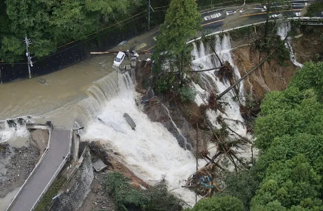 This aerial photo shows a collapsed road in Kishiwada, Osaka, western Japan Monday, October 23, 2017 after heavy rain brought by a powerful typhoon. (Photo by Yuki Sato/Kyodo News via AP Photo)