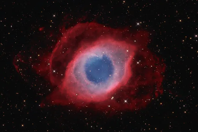 “The Helix Nebula”. Resembling a giant eye looking across 700 light years of space, the Helix Nebula ia one of the closest planetarty nebula to Earth. The image reveales intricate details in the glowing gas that compirses the nebula including the tadpole-like 'cometary knots' that appear to stream from the inner edge of the gaseous ring. (Photo by David Fitz-Henry, Australia/The Astronomy Photographer of the Year 2014 Contest)