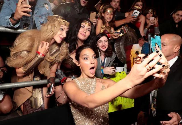 Actor Gal Gadot takes a group selfie with Wonder Woman fans at a screening of Justice League at Dolby Theater in Los Angeles, California on November 13, 2017. (Photo by Eric Charbonneau/Rex Features/Shutterstock)