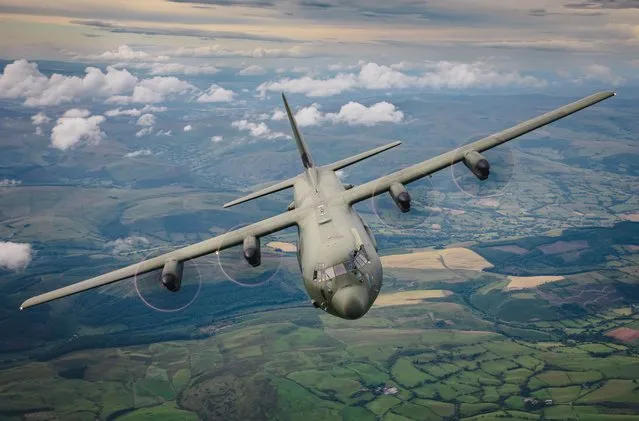 A huge RAF military transport C130 Hercules flying through Snowdonia, United Kingdom in July 2022. (Photo by Royal Air Force/South West News Service)