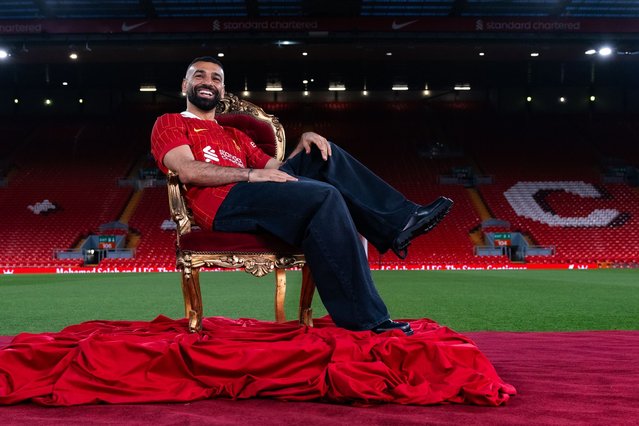 In this image released on April 11, Mohamed Salah of Liverpool poses for photos as he signs a new contract extension at Anfield on April 10, 2025 in Liverpool, England. (Photo by Nikki Dyer – LFC/Liverpool FC via Getty Images)