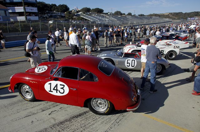 Visitors attend the "Concours on Pit Lane" during the Porsche Rennsport Reunion V at Laguna Seca Raceway near Salinas, California, September 26, 2015. (Photo by Michael Fiala/Reuters)