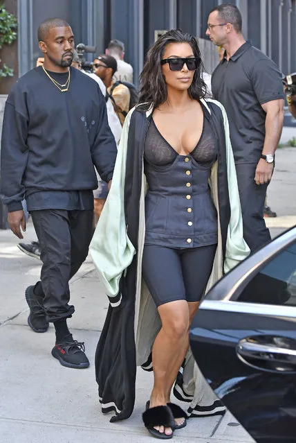 Kim Kardashian wears a see-through bustier corset showing her cleavage while exiting her New York AirBnb apartment with Kanye following behind on their way to Kanye's concert in Toronto on August 30, 2016. (Photo by Splash News and Pictures)