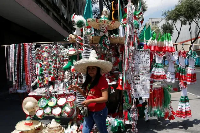 A vendor is pictured near the Zocalo square, before the “Cry of Independence” ceremony to mark the 206th anniversary of the day rebel priest Manuel Hidalgo set the path to independence in Mexico City, Mexico September 15, 2016. (Photo by Carlos Jasso/Reuters)