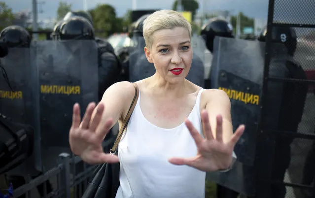 Maria Kolesnikova, one of Belarus' opposition leaders, center, gestures during a rally in Minsk, Belarus, Sunday, August 30, 2020. Tens of thousands of demonstrators have gathered in the capital of Belarus, beginning the fourth week of daily protests demanding that the country's authoritarian president resign. The protests began after an Aug. 9 presidential election that protesters say was rigged and officials say gave President Alexander Lukashenko a sixth term in office. (Photo by Tut.By via AP Photo)