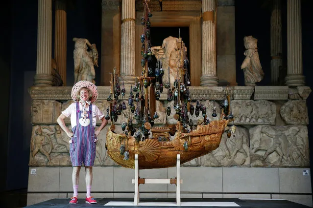 British artist Grayson Perry poses next to his work of art entitled “The Tomb of the Unknown Craftsman”, on display at the British Museum, in London, Britain on August 20, 2020. (Photo by Henry Nicholls/Reuters)