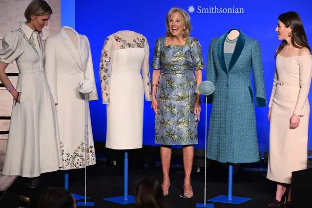 (L-R) Uruguayan-US fashion designer Gabriela Hearst, US First Lady Jill Biden, and US fashion designer Alexandra O'Neill stand for a photo during the presentation of Biden's 2021 inaugural ensembles to the Smithsonian's National Museum of American History in Washington, DC, on January 25, 2023. The blue wool tapered tweed dress with overcoat designed by Alexandra ONeill, and evening dress and coat by Gabriela Hearst, will be part of The First Ladies exhibition at the museum. (Photo by Mandel Ngan/AFP Photo)