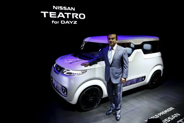 Carlos Ghosn, chief executive officer of Nissan Motor Co and Renault SA, poses in front of the Nissan Teatro for Dayz concept car at the 44th Tokyo Motor Show in Tokyo October 28, 2015. (Photo by Thomas Peter/Reuters)