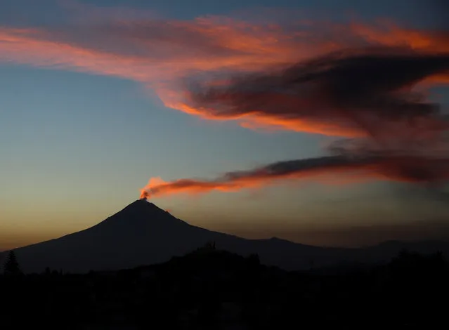 A general view shows a column of steam emerging from Popocatepetl volcano, after an increase in volcanic activity with steam and ash eruptions have been registered recently, according to local media, as seen from San Andres Cholula municipality, in the state of Puebla, Mexico on February 1, 2023. (Photo by Henry Romero/Reuters)