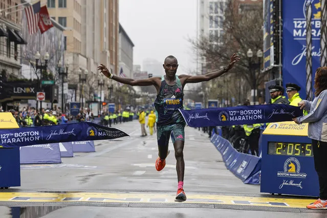 Evans Chebet of Kenya breaks the tape to win the 127th Boston Marathon, Monday, April 17, 2023, in Boston. (Photo by Winslow Townson/AP Photo)