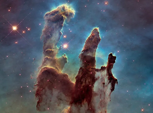 A Hubble telescope photograph of the iconic Eagle Nebula's “Pillars of Creation” is seen in this NASA image released January 6, 2015. (Photo by Reuters/NASA/ESA/Hubble Heritage Team)