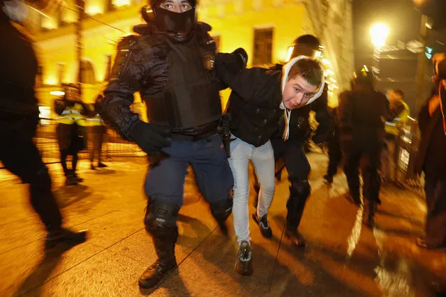 Russian reinforced policemen detain Navalny's supporter in downtown of St. Petersburg, Russia, 02 February 2021. The visiting session of the Simonovsky city court decided to grant the Federal Penitentiary Service petition to replace the suspended sentence with a real one. 3.5 years in a general regime colony, while the time spent under house arrest during the investigation of the 'Yves Rocher' case must be credited. Thus, when the sentence comes into force, the term will be 2 years 8 months. Opposition leader Alexei Navalny was detained after his arrival to Moscow from Germany on 17 January 2021. A Moscow judge on 18 January ruled that he will remain in custody for 30 days following his airport arrest. (Photo by Anatoly Maltsev/EPA/EFE)