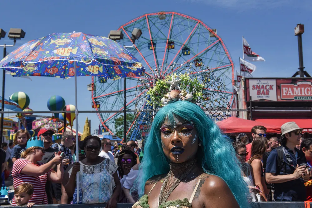 Next picture →. People participate in the 36th annual Mermaid Parade in Con...