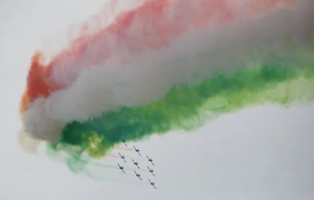 The aerobatic demonstration team of the Italian Air Force, Frecce Tricolori, performs before the start of the race of the Emilia Romagna Formula One Grand Prix at the Autodromo Internazionale Enzo e Dino Ferrari race track in Imola, Italy on April 24, 2022. (Photo by Massimo Pinca/Reuters)