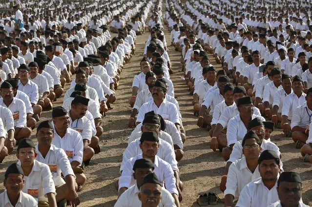 Volunteers of the Hindu nationalist organisation Rashtriya Swayamsevak Sangh (RSS) attend a conclave on the outskirts of Pune, India, January 3, 2016. Thousands of volunteers attended the gathering which was held to promote the organisation and reach out to the society, according to local media reports. (Photo by Danish Siddiqui/Reuters)