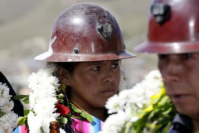 A mine worker attends a celebration at the Itos (Nueva San Jose) silver and base metals mine during a celebration in the outskirts of Oruro, February 13, 2015. (Photo by David Mercado/Reuters)