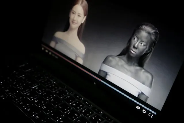 An online advertisement by Thai cosmetics company Seoul Secret showing Thai actress Cris Horwang, right, is displayed on a computer screen in Bangkok, Thailand, Friday, January 8, 2016. The company has pulled a video in which the Thai movie star wears blackface and promotes a skin-whitener with the slogan: "You just need to be white to win." Seoul Secret issued a "heartfelt apology," saying in a statement it had had no intention to convey racist messages. (Photo by Charles Dharapak/AP Photo)