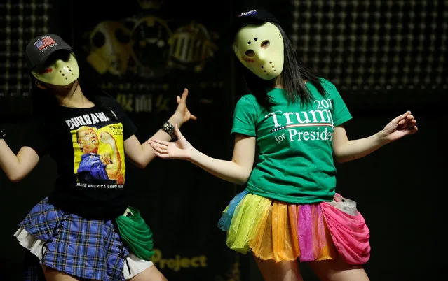 Members of Japanese idol group Kamen Joshi (Masked Girls) in attires featuring images or names of U.S. President-elect Donald Trump, attend a rehearsal for a concert at their theatre in Tokyo's Akihabara district, Japan, December 12, 2016. (Photo by Toru Hanai/Reuters)