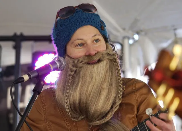 Allison Weis, wearing a Bredo beard plays banjo at Frozen Dead Guy Days in Nederland, Colorado March 14, 2015. (Photo by Rick Wilking/Reuters)