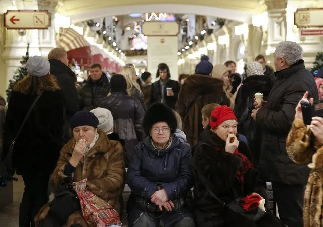 People rest at the GUM department store in central Moscow, Russia December 17, 2016. (Photo by Maxim Shemetov/Reuters)