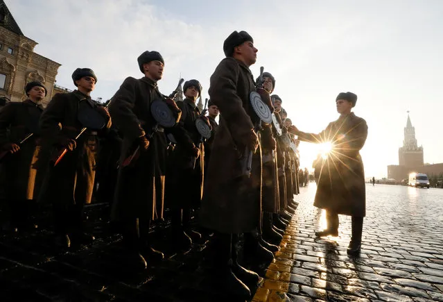 Participants gather during preparations for a military parade to mark the anniversary of a 1941 parade in Red Square in Moscow on November 7, 2018. (Photo by Shamil Zhumatov/Reuters)