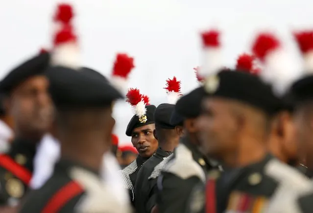 An army soldier looks back at the parade during a rehearsal for Sri Lanka's 68th Independence day celebrations in Colombo, February 2, 2016. (Photo by Dinuka Liyanawatte/Reuters)
