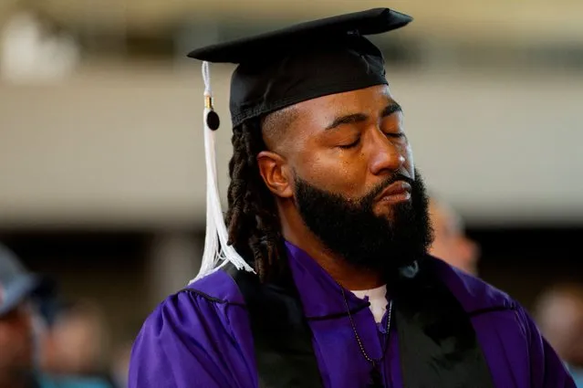 A prisoner sheds a tear before receiving his bachelor's degree from Northwestern University during a graduation ceremony for students who went through the inaugural class of the Northwestern Prison Education Program at Stateville Correctional Center in Crest Hill, Illinois, U.S., November 15, 2023. (Photo by Vincent Alban/Reuters)