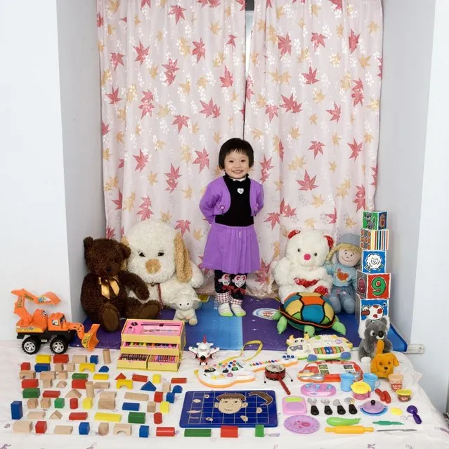 Cun Zi Yi – Chongqing, China. Cun Zi Yi just turned 3, and received a lot of gifts for her birthday. She plays with everything and can’t choose her favorite toy. Her parents say that she’s really good at painting, and will be an artist when she grows up. “Toy Stories” project. (Gabriele Galimberti)
