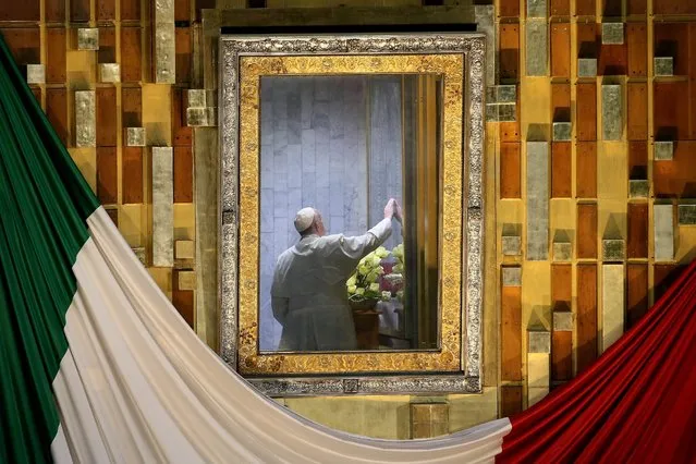 Pope Francis sits in a room behind the altar to pray before the image of Our Lady of Guadalupe while celebrating mass at the Basilica of Guadalupe in Mexico City, 13 February 2016. Pope Francis landed in the Mexican capital late 12 February for his first visit to the predominantly Catholic country. His tour will last until 17 February, and take him to six cities in four states. The pope has spoken out against the high rates of crime and poverty in the country. (Photo by Alessandro Di Meo/EPA)