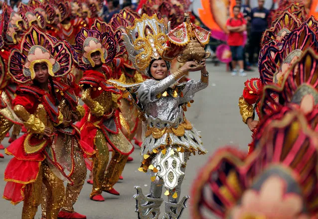 Filipinos wearing a colorful costumes perform during the “Sinulog” Grand Parade marking the feast of Child Jesus in Cebu City, Philippines, 15 January 2017. Thousands of Filipino revelers flocked to the streets of Cebu City to witness the grand parade of the Sinulog Festival. Sinulog is a dance ritual in honor of the miraculous image of the Santo Nino. (Photo by Jay Rommel Labra/EPA)