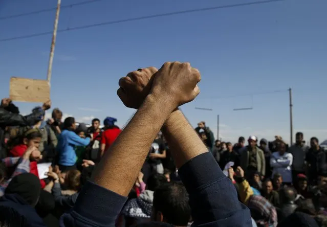 A man gestures as other migrants block the railway track at the Greek-Macedonian border, near the village of Idomeni, Greece March 3, 2016. (Photo by Marko Djurica/Reuters)