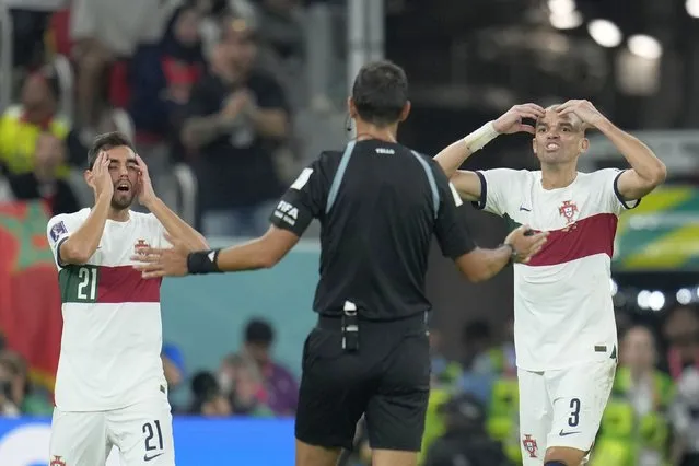 Portugal's Ricardo Horta, left, and Portugal's Pepe gestures to referee Facundo Tello from Argentina during the World Cup quarterfinal soccer match between Morocco and Portugal, at Al Thumama Stadium in Doha, Qatar, Saturday, December 10, 2022. (Photo by Ricardo Mazalan/AP Photo)