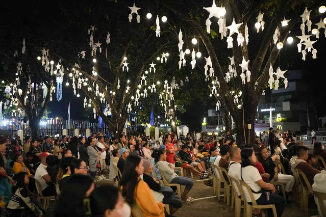 Devotees attend the first of nine daily dawn Masses at the International Shrine of Our Lady of Peace and Good Voyage in Antipolo, Philippines on Saturday, December 16, 2023. Filipinos attend nine consecutive dawn Masses before Christmas as part of traditional Filipino practice in this largely Roman Catholic nation. (Photo by Aaron Favila/AP Photo)