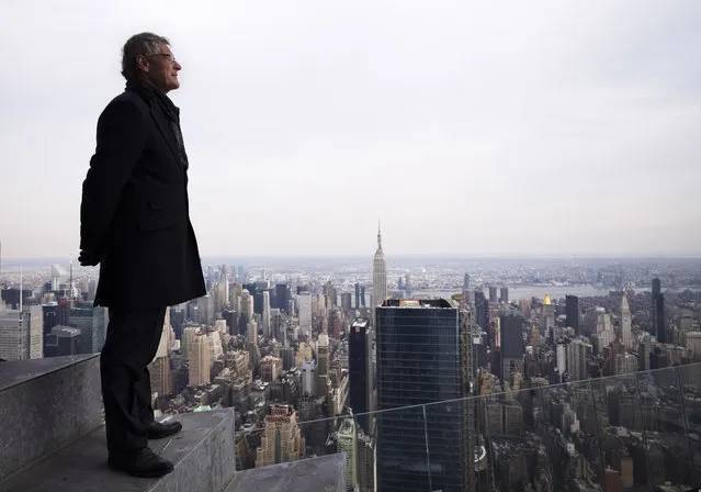 In this March 8, 2019 photo, Jay Cross, president of Related Hudson Yards, stands on an outdoor observation deck named “The Edge”, 1100 feet (367 meters) off the ground in New York. Located at the new skyscraper known as 30 Hudson Yards, it is scheduled to open to the public at the end of 2019. (Photo by Mark Lennihan/AP Photo)