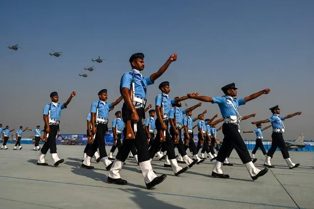 Indian Air Force (IAF) soldiers march during the 89th Air Force Day parade at Hindon Air Force station in Ghaziabad on October 8, 2021. (Photo by Prakash Singh/AFP Photo)