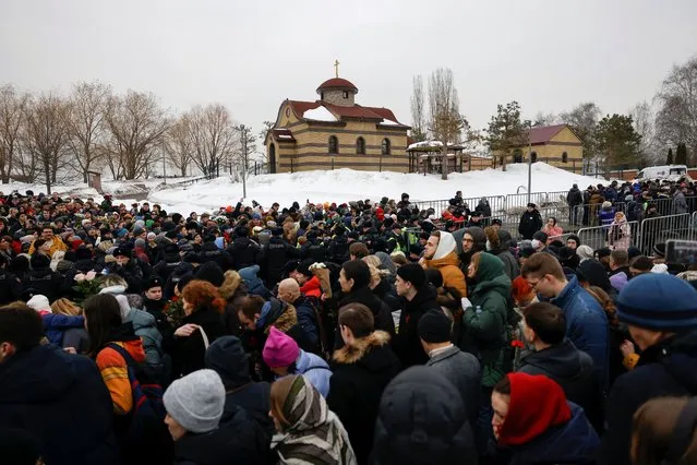 People gather near the Borisovskoye cemetery during the funeral of Russian opposition politician Alexei Navalny in Moscow, Russia, on March 1, 2024. (Photo by Reuters/Stringer)