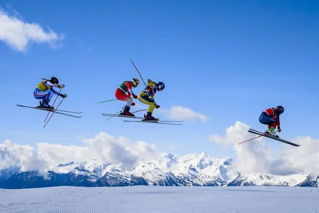Mathilde Brodier of France, Margaux Dumont of Switzerland, Johanna Holzmann of Germany and Marielle Thompson of Canada in action during the 1/4 final of the women's Ski Cross event at the FIS Ski Cross, SX, World Cup, in Veysonnaz, Switzerland, 16 March 2024. (Photo by Jean-Christophe Bott/EPA)