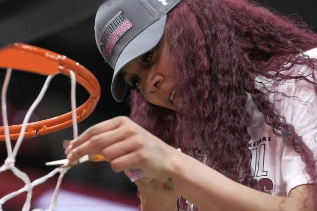 South Carolina center Kamilla Cardoso cuts down the net after the Final Four college basketball championship game against Iowa in the women's NCAA Tournament, Sunday, April 7, 2024, in Cleveland. South Carolina won 87-75. (Photo by Morry Gash/AP Photo)
