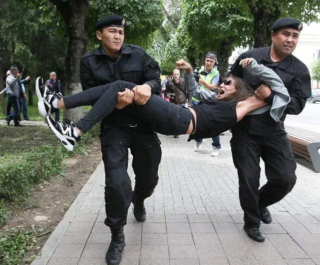 Police officers detain an opposition supporter during a protest against presidential election results, in Almaty, Kazakhstan, June 10, 2019. (Photo by Pavel Mikheyev/Reuters)
