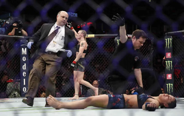 Valentina Shevchenko, rear, celebrates after knocking out Jessica Eye during their women's flyweight title mixed martial arts bout at UFC 238, Saturday, June 8, 2019, in Chicago. (Photo by Kamil Krzaczynski/AP Photo)