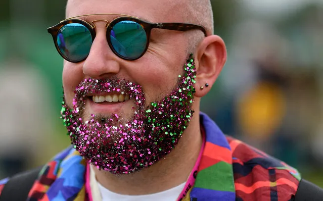 Festival-goers arrive on the first day of the Glastonbury Festival at Worthy Farm in Somerset, Britain 26 June 2019. Glastonbury Festival of Contemporary Performing Arts is a five-day festival of contemporary performing arts that takes place in Pilton, Somerset, west England, from 26 to 30 June 2019. (Photo by Neil Hall/EPA/EFE)